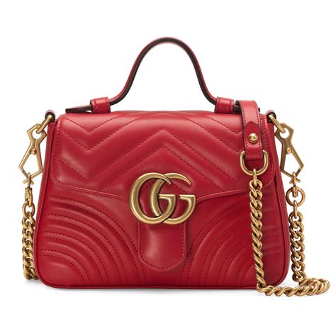 GG Marmont Medium bouclé shoulder bag in red .